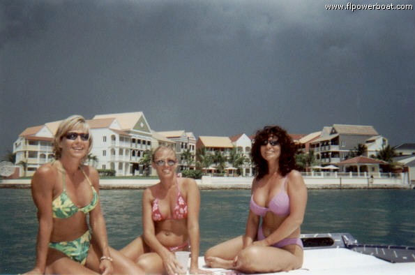 SCENIC CRUISE
Shelly, Deanna and Shelly, enjoy a scenic cruise aboard Pat Queenan's Cigarette, HARD CANDY. The colorful building is the Pelican Bay Resort at Port Lucaya.
