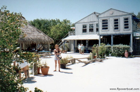 Barnacle Phil's
Cool Place! Let me check the charts again....it could swear we're in the Florida Keys! This rustic little restaurant is nestled back into a little cove along the eastern shore of North Captiva Island. Whats really cool is that the romantic island is full of neat cottages connected by small pathes. The mode of trans...bicycles and golf carts! There are no cars on the island!
